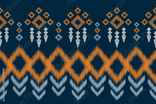 Ethnic Ikat fabric pattern geometric style.African Ikat embroidery Ethnic oriental pattern navy blue background. Abstract,vector,illustration.For texture,clothing,scraf,decoration,carpet.