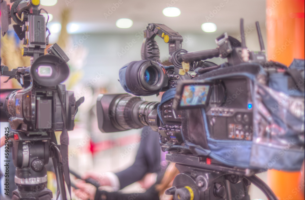 cameraman filming an interview cameraman filming an interview