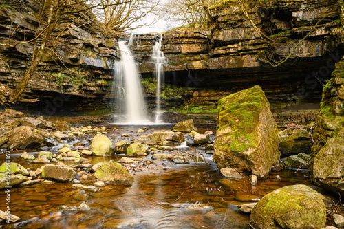 Summerhill Force over Gibson Cave, on Bow Lee Beck which runs through a ravine in Upper Teesdale near Newbiggin and is in the North Pennines AONB, as a tributary to the River Tees photo