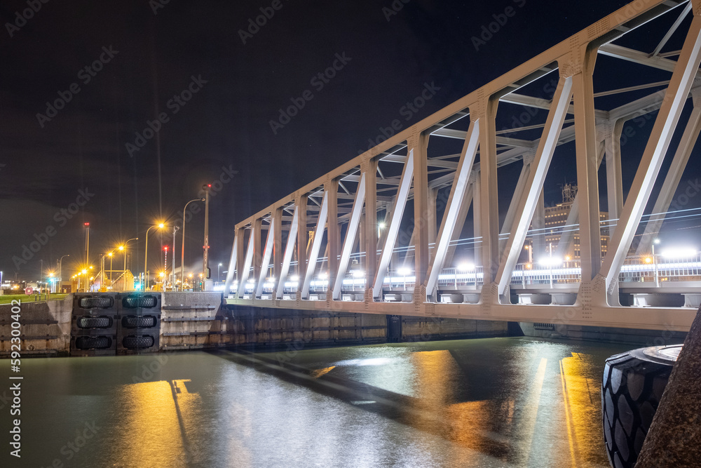 Night view of illuminated bridge above of river Scheldt in Antwerp, Belgium. High quality photo