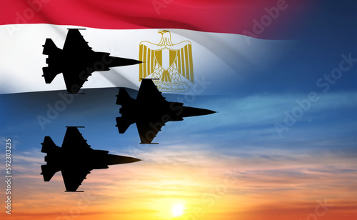 Silhouette of a military aircraft with Egypt flag afainst the sunset. Air Force of Egypt concept. EPS10 vector