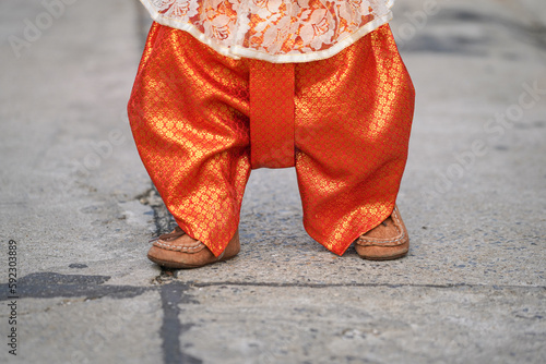 Close-up at a girl body is wearing traditional Thai dress for Songkran festival.