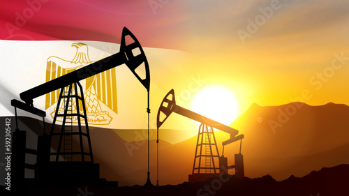 Silhouette of Oil pump on background of flag of Egypt against the sunset or sunrise. Egypt Oil Industry concept. EPS10 vector