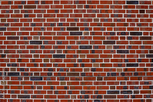 Close-up of red brick wall of industrial building on a cloudy winter day. Photo taken February 17th, 2023, Wallisellen, Switzerland.