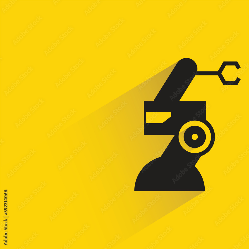 industrial robotic arm with shadow on yellow background