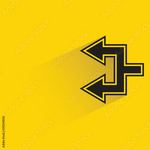 junction arrow with shadow on yellow background