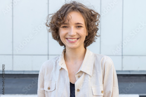Tablou pe pânză Close-up portrait of a young twenty year old woman looking at the camera