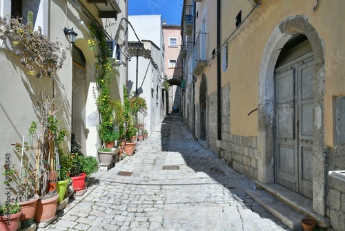 A narrow street among the old houses of Larino, a medieval town in the province of Campobasso in Italy. photo