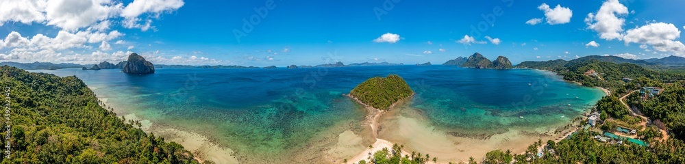 Drone panorama of the paradisiacal Maremegmeg beach near El Nido on the Philippine island of Palawan during the day