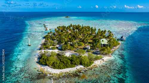 Aerial of a little island at the Avatoru Pass, Rangiroa atoll, Tuamotus, French Polynesia, South Pacific