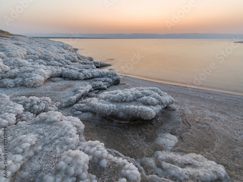 Shore with salt crystalized formation at dusk, The Dead Sea, Jordan, Middle East