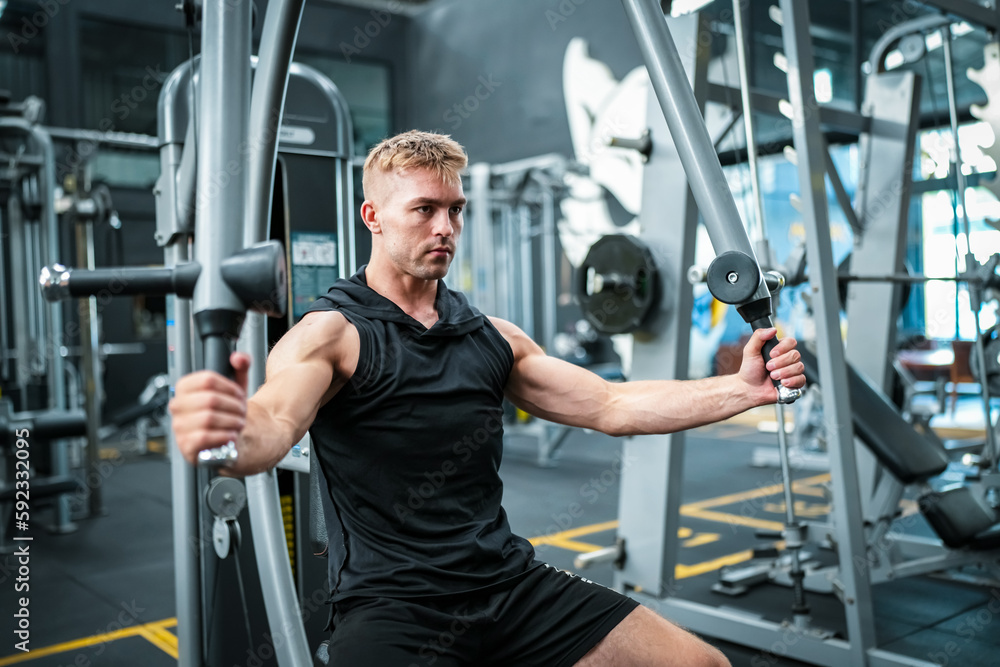 Male athlete exercising in the gym, lifting weights, pulling joints. Male athlete exercising in the gym, lifting weights, pulling joints.