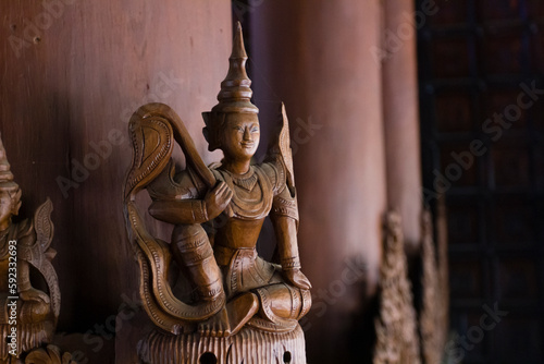 Wooden Buddha statue decoration inside wooden temple, Shwenandaw Temple, Mandalay, Myanmar photo