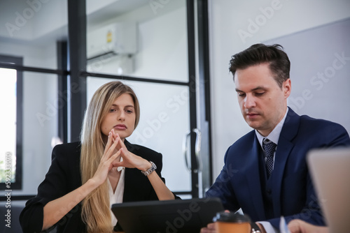 Business discussions. Shot of business people discussing and brainstorming in an office