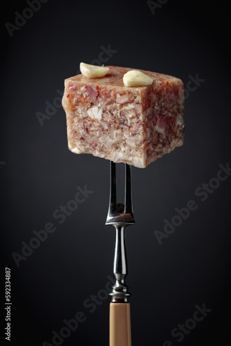Headcheese on a fork.