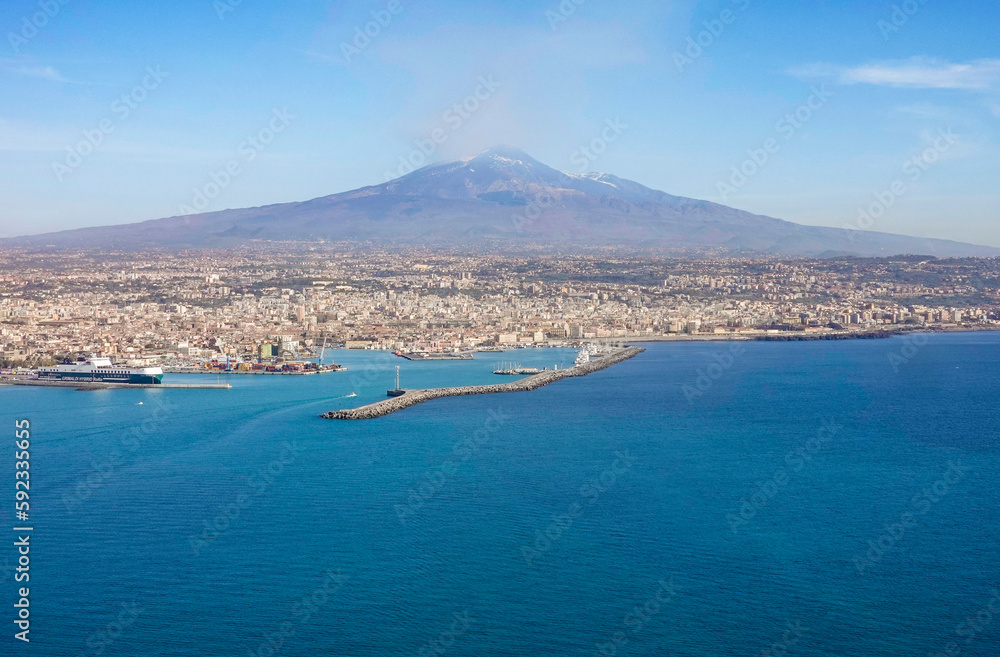 View of Etna volcano and Catania in Sicily