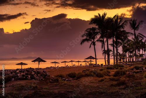 View of Playa de los Pocillos beach at sunset, Puerto del Carmen, Lanzarote, Las Palmas photo