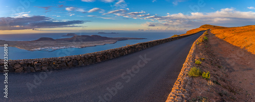 View of road and La Graciosa Island from Mirador del Rio at sunset, Lanzarote, Las Palmas photo