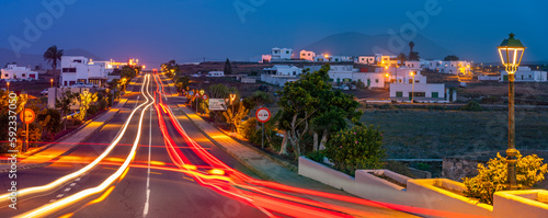 View of trail lights through the town of Tinajo at dusk, Tinajo, Lanzarote, Las Palmas photo