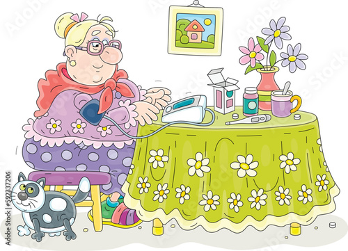 Funny granny sitting at her beautiful kitchen table with flowers and monitoring blood pressure and heart beat with a home medical device, vector cartoon illustration isolated on a white background photo