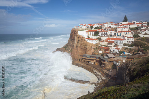 Atlantic Ocean waves breaking below cliffs of Azenhas do Mar on the west coast, Azenhas do Mar, Lisbon Region, Portugal photo