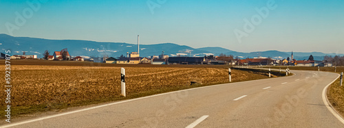 Winter landscape on a sunny day with a sugar factory near Plattling, Deggendorf, Bavaria, Germany