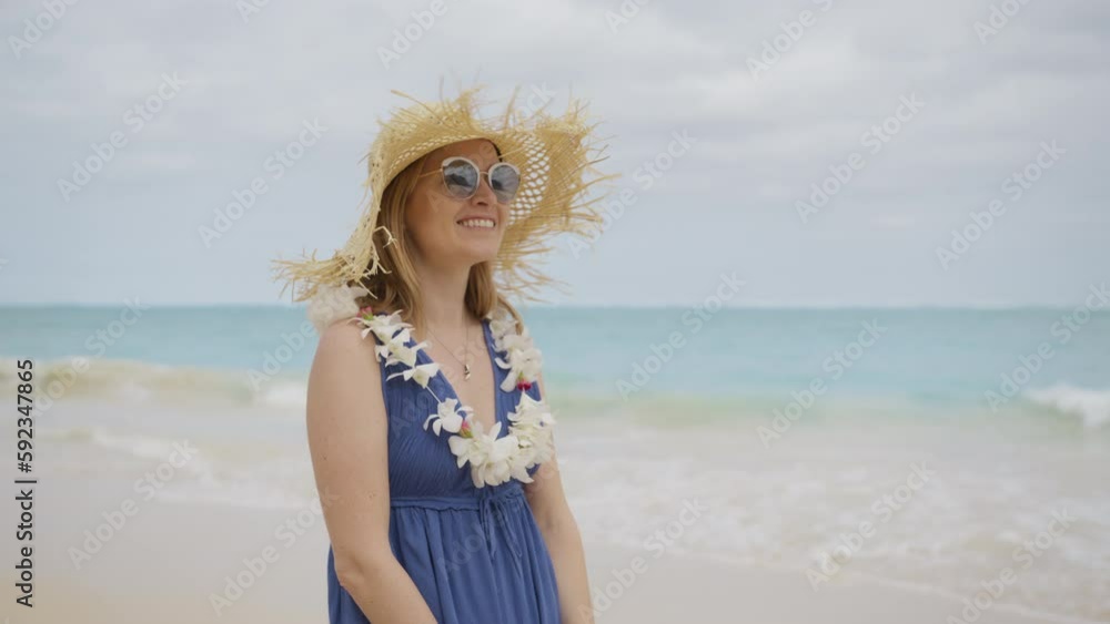 Outdoor portrait of happy romantic lady standing on tropical beach at beautiful ocean bokeh background. Smiling girl in trendy boho fashion style and straw hat. Travel vacation, Hawaii summer pleasure Outdoor portrait of happy romantic lady standing on tropical beach at beautiful ocean bokeh background. Smiling girl in trendy boho fashion style and straw hat. Travel vacation, Hawaii summer pleasure