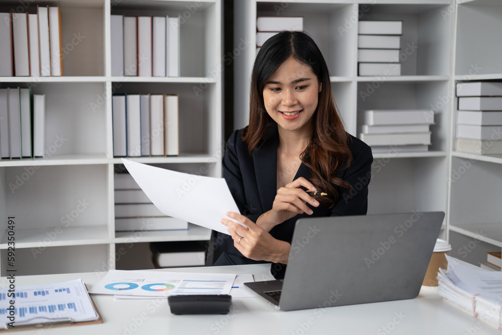Young beautiful businesswoman working in the modern office room. sitting at her office desk. Young beautiful businesswoman working in the modern office room. sitting at her office desk.