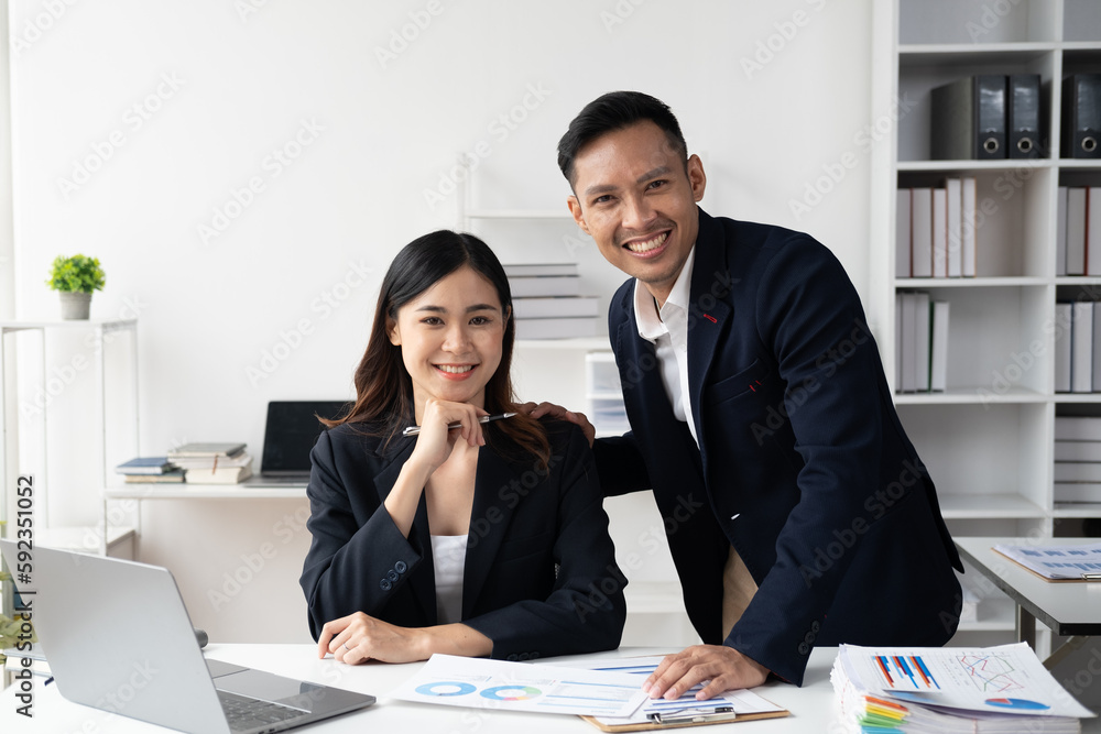Portrait of happy smiling Asian business team working togerther in the company office. Portrait of happy smiling Asian business team working togerther in the company office.