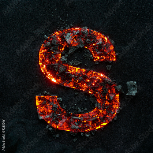 фотографія The burning capital letter S on a black background is made of hot coals