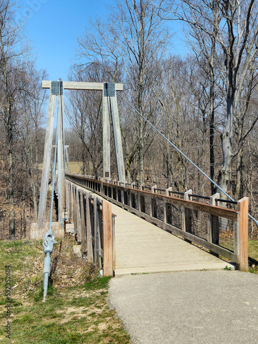 Fototapeta Naklejka Na Ścianę i Meble -  Vacant pedestrian suspension bridge in Michigan