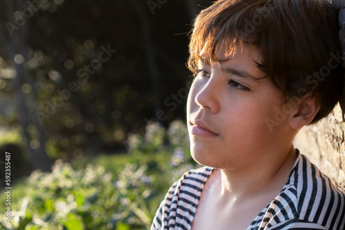 Portrait of a Latin kid with sad expression. Copy space.