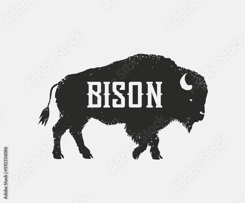 Symbol of the silhouette of a bison (bull), in the form of standing on his feet and looking forward. Vector illustration.