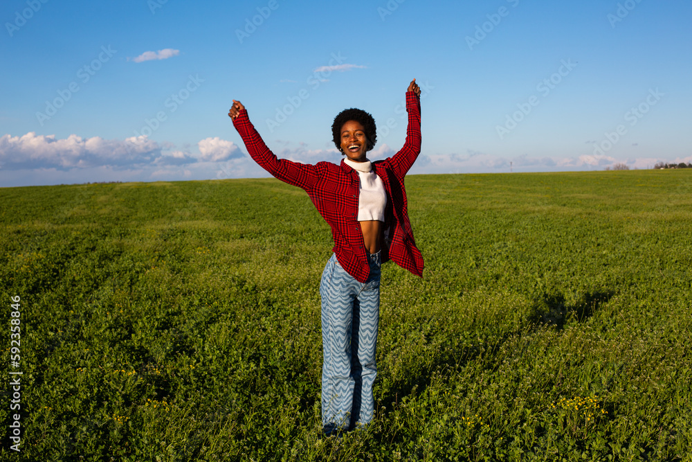African girl in green meadow