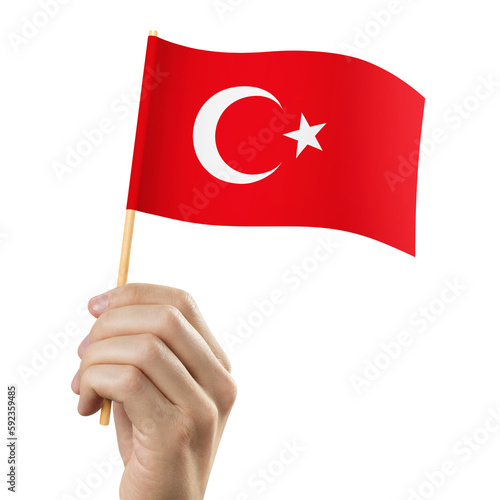 Hand holding flag of Turkey, cut out photo