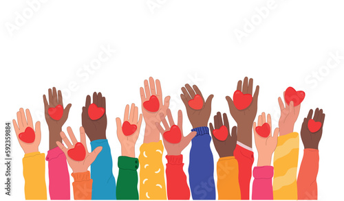 Hands raised up hold hearts, share compassion and hope with those in need. National Volunteering Month is celebrated every year in April. Compassion. The concept of sharing love.