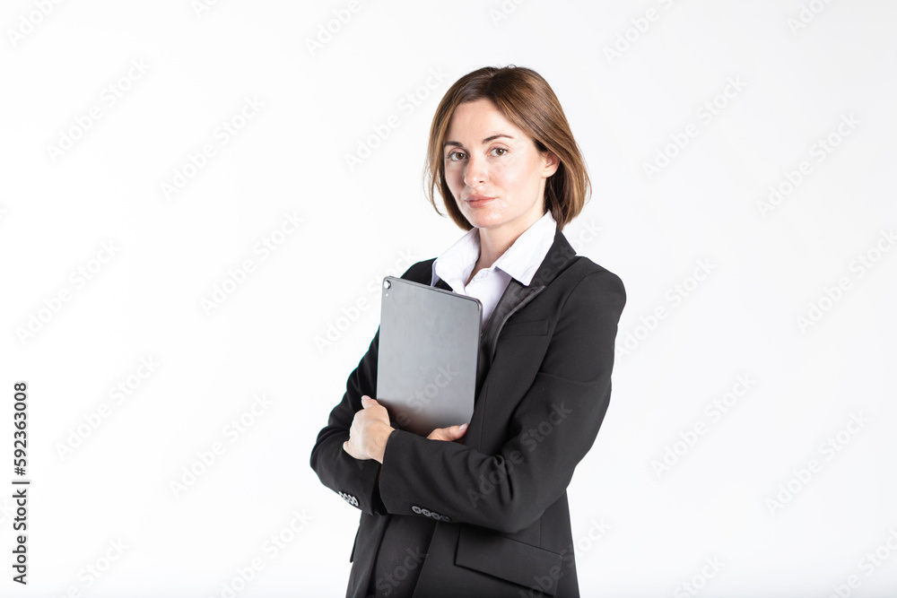 Young attractive and smiling business woman in black suit holding gadget isolated on white. Copy space and place for text concept Young attractive and smiling business woman in black suit holding gadget isolated on white. Copy space and place for text concept