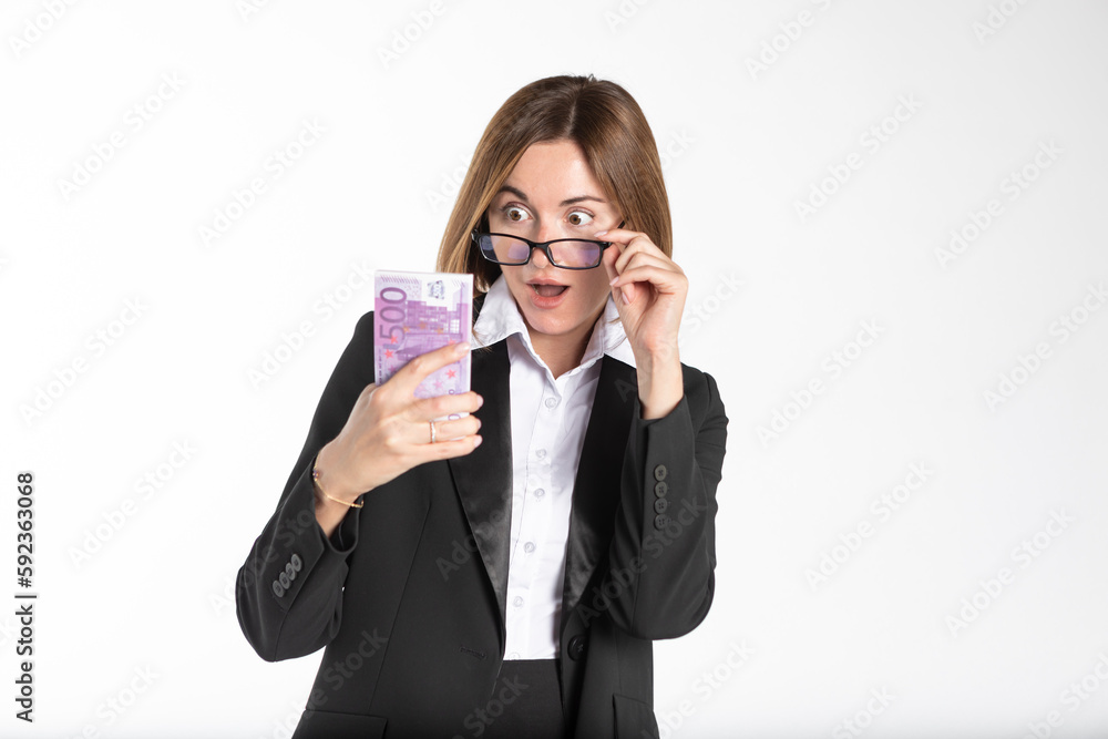 Happy business woman holding pack of money isolated on white background Happy business woman holding pack of money isolated on white background