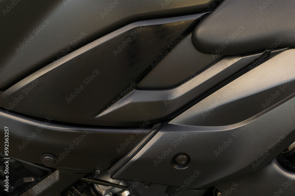 Detail of the tank of a black motorcycle close up Detail of the tank of a black motorcycle close up