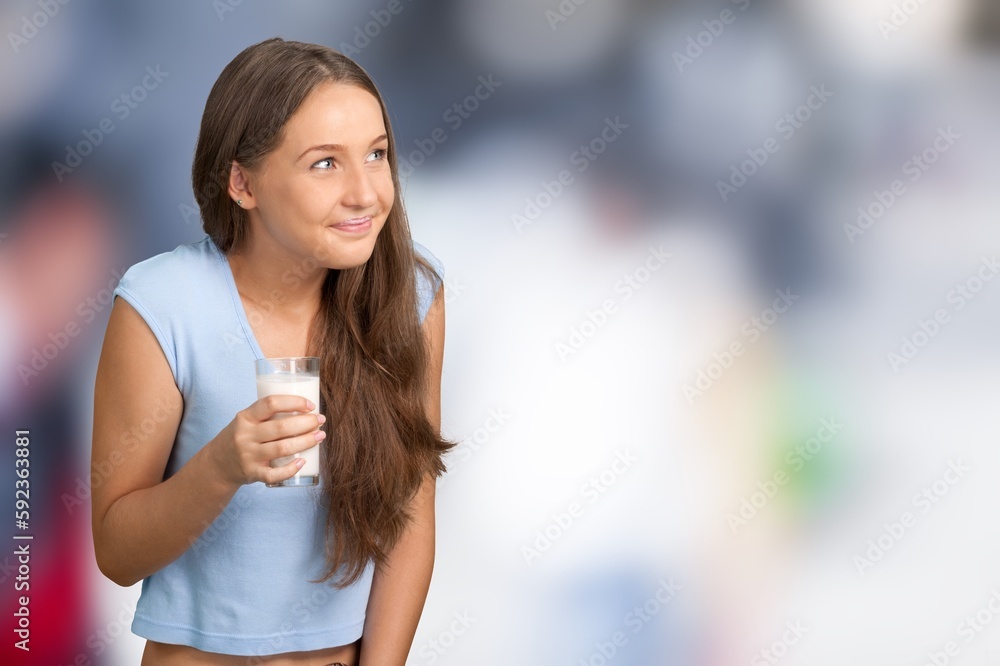 Cute child drinking milk smiling happily