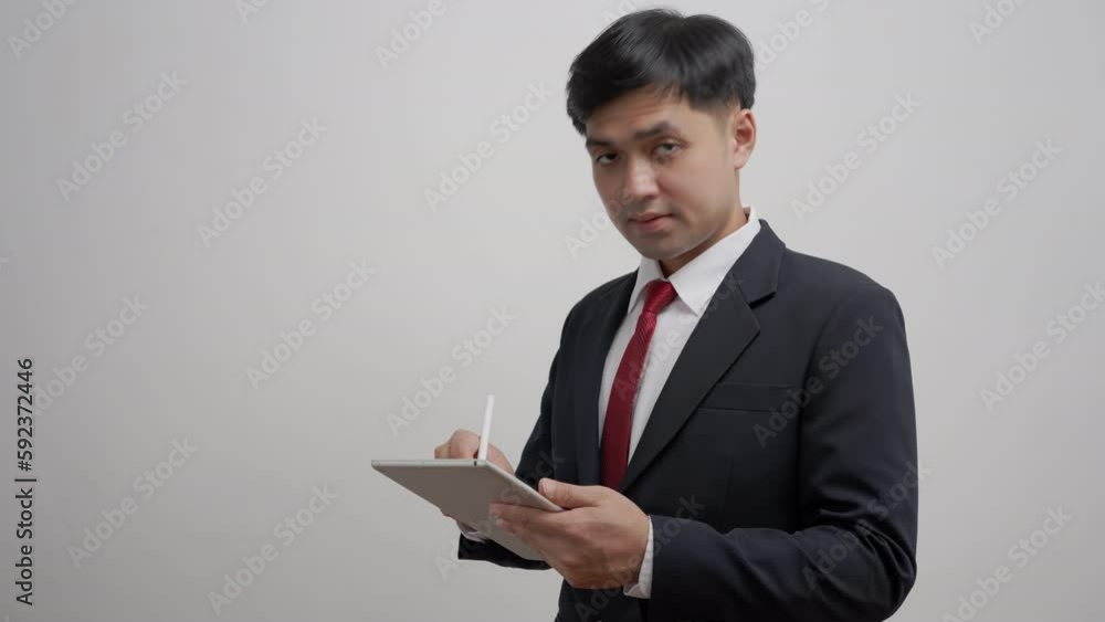 working man, Portrait of smiling Asia male in work clothes using laptop, sit at office and doing research, copy space, happy cheerful cute business, positive energy, Business plan, men executive. working man, Portrait of smiling Asia male in work clothes using laptop, sit at office and doing research, copy space, happy cheerful cute business, positive energy, Business plan, men executive.