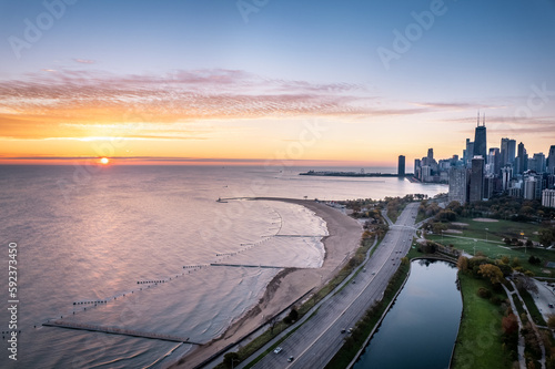 Aerial sunset view of Chicago Skyline and Lake Michigan with Lincoln Park Zoo in foreground, Illinois, USA photo
