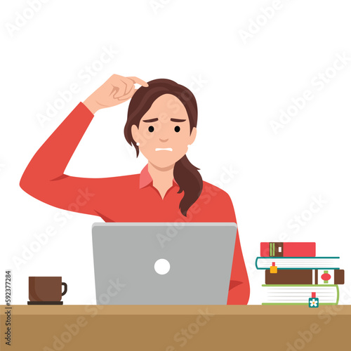 Business woman with anxious face with the work she is doing on a laptop