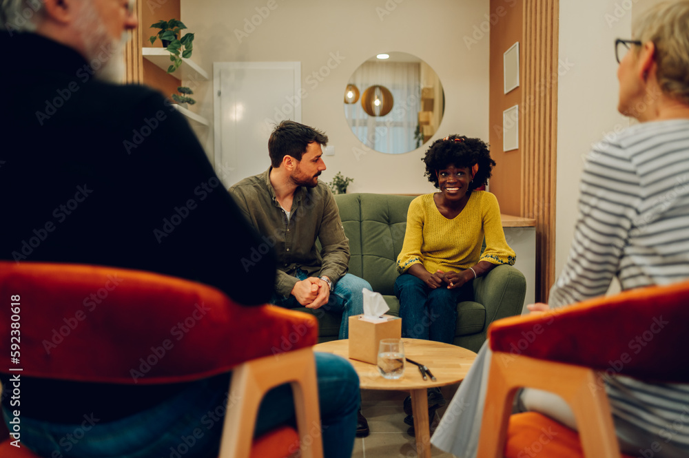 Obraz premium Multiracial people talking about their mental health on a group therapy session
