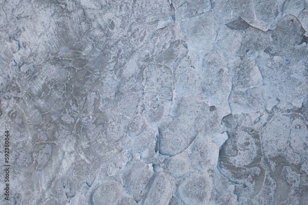 Fototapeta premium Abstract gray rocky stone background surface with cracks