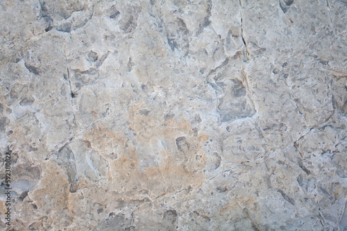 White stone surface, abstract rocky background, pattern with cracks