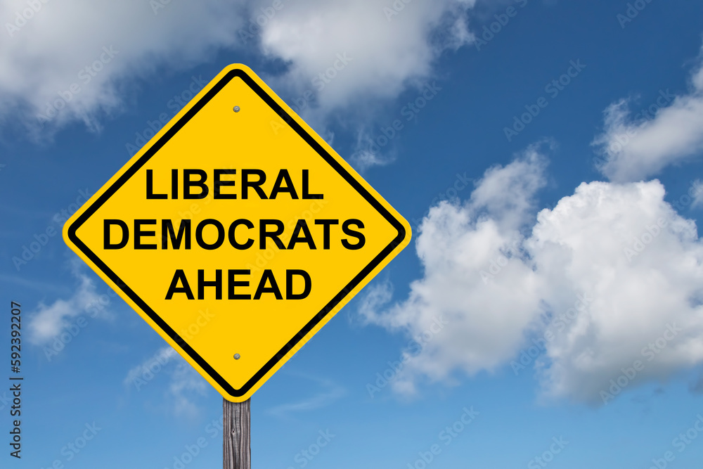 Liberal Democrats Ahead Caution Sign - Blue Sky Background Liberal Democrats Ahead Caution Sign - Blue Sky Background