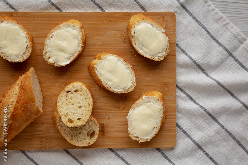 Homemade Bread and Butter on a bamboo board, top view. Flat lay, overhead, from above.