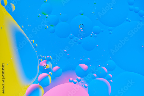 Bright abstract  multicolored background with oil circles.