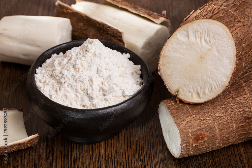 Raw Cassava Root And Starch - Manioc Esculenta; On Wooden Background